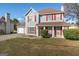 Charming two-story home with red shutters, light blue siding, and a well-manicured lawn at 453 Camp Hill Ln, Jonesboro, GA 30238
