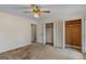 Bedroom featuring a ceiling fan, and built-in closet with ample storage at 210 Heritage Cir, Mcdonough, GA 30253
