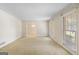 Bright, spacious living room with large windows for natural light at 210 Heritage Cir, Mcdonough, GA 30253