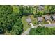 Aerial view of a home with a long driveway and a spacious backyard at 470 Louise Way, Locust Grove, GA 30248