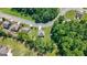 Aerial view of neighborhood and home, surrounded by mature trees at 470 Louise Way, Locust Grove, GA 30248
