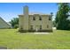 Rear of home featuring a large yard, patio, and ample natural light at 470 Louise Way, Locust Grove, GA 30248