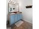 Bathroom featuring double vanity with a large framed mirror, sconce lighting, and tile flooring at 470 Louise Way, Locust Grove, GA 30248