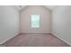 Bedroom with neutral carpet, natural light, and vaulted ceilings at 470 Louise Way, Locust Grove, GA 30248