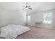 Large primary bedroom featuring a ceiling fan and ample natural light at 470 Louise Way, Locust Grove, GA 30248
