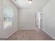 Bedroom featuring carpeted floors, natural light, and door to bathroom at 470 Louise Way, Locust Grove, GA 30248