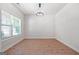Bright dining room featuring wood-look floors, ample natural light, and a modern chandelier at 470 Louise Way, Locust Grove, GA 30248