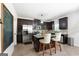 Modern kitchen with stainless steel appliances, a center island, and dark wood cabinetry at 470 Louise Way, Locust Grove, GA 30248