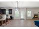 Open living area featuring a fireplace, recessed lighting, and wood-look floors at 470 Louise Way, Locust Grove, GA 30248