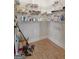 Walk-in pantry with wood-look floors and ample shelving for food storage at 470 Louise Way, Locust Grove, GA 30248
