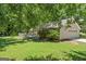 Backyard view featuring an attached garage and white picket fence at 380 Peach Drive, Mcdonough, GA 30253
