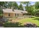 Backyard view featuring a fire pit, and a white picket fence at 380 Peach Drive, Mcdonough, GA 30253
