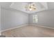 Bright bedroom featuring a ceiling fan and a large window that provides ample natural light at 380 Peach Drive, Mcdonough, GA 30253