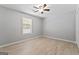 Bright bedroom with a ceiling fan and a large window allowing plenty of natural light at 380 Peach Drive, Mcdonough, GA 30253