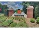 Peach Pointe entrance sign with brick columns and landscaped garden at 380 Peach Drive, Mcdonough, GA 30253