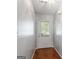 Entryway features hardwood floors and a glass panel door to let in natural light at 380 Peach Drive, Mcdonough, GA 30253