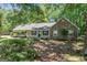 Charming single-story home featuring a stone facade, inviting front porch and nicely landscaped front yard at 380 Peach Drive, Mcdonough, GA 30253
