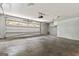 A spacious two-car garage with an automatic door and overhead lighting at 380 Peach Drive, Mcdonough, GA 30253