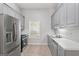 Well-equipped kitchen with stainless steel appliances and light gray cabinets at 380 Peach Drive, Mcdonough, GA 30253