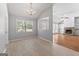Open-concept design connects the dining room and living room with stone fireplace at 380 Peach Drive, Mcdonough, GA 30253