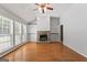 Spacious living room boasting a stone fireplace with built-in shelving at 380 Peach Drive, Mcdonough, GA 30253