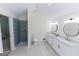 Modern bathroom featuring a double vanity, a walk-in shower with contemporary tile, and recessed lighting at 115 Brookwood Ln, Fayetteville, GA 30215