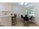 Bright dining area features a glass table, seating for four, and a large window with natural light at 115 Brookwood Ln, Fayetteville, GA 30215