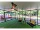 Inviting enclosed patio with turf flooring and backyard views at 115 Brookwood Ln, Fayetteville, GA 30215