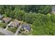Aerial view of the home and surrounding area, showcasing its location near a lake at 1360 Mount Mckinley Dr, Grayson, GA 30017