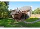 Back of home showing multilevel deck and patio at 1360 Mount Mckinley Dr, Grayson, GA 30017