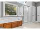 Bright bathroom featuring a soaking tub, shower, and a large window at 1360 Mount Mckinley Dr, Grayson, GA 30017