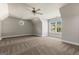 Spacious carpeted room features large windows offering bright natural light and a ceiling fan at 1360 Mount Mckinley Dr, Grayson, GA 30017