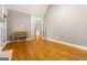 Bedroom with hardwood floors, neutral paint, and an open door to the next room at 1360 Mount Mckinley Dr, Grayson, GA 30017