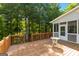 Wooden deck overlooks the wooded backyard with views of the lake at 1360 Mount Mckinley Dr, Grayson, GA 30017