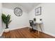 Home office with desk, chair, hardwood floors, house plant, and natural light at 1360 Mount Mckinley Dr, Grayson, GA 30017