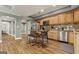 Modern kitchen with stainless steel appliances, wooden cabinets, and a breakfast bar for added seating at 1360 Mount Mckinley Dr, Grayson, GA 30017