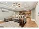 Cozy living room features a large sectional, recessed lighting, and an open floorplan with kitchen access at 1360 Mount Mckinley Dr, Grayson, GA 30017