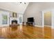 Cozy living room with hardwood floors, fireplace, vaulted ceiling and large windows at 1360 Mount Mckinley Dr, Grayson, GA 30017