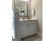 Bathroom with white vanity, gray walls, and a silver framed mirror with white towels at 160 Elysian Dr, Fayetteville, GA 30214