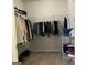 Spacious walk-in closet with hanging rods, shelves, and carpeted floor at 160 Elysian Dr, Fayetteville, GA 30214
