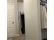 Walk-in closet with hanging clothes and shelving, providing ample storage at 160 Elysian Dr, Fayetteville, GA 30214