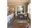 Bright breakfast area featuring modern stools, natural light, and a view of the kitchen, blending style and functionality at 160 Elysian Dr, Fayetteville, GA 30214