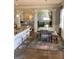 Open layout showcasing the dining area with stylish seating and natural light, flowing into adjacent living spaces at 160 Elysian Dr, Fayetteville, GA 30214