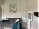 Comfortable living room with a gray couch, pillows, and modern artwork at 160 Elysian Dr, Fayetteville, GA 30214