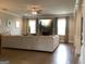 Bright living room with a large sectional sofa, fireplace, and ample natural light creates a cozy and welcoming space at 160 Elysian Dr, Fayetteville, GA 30214