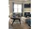 Bright and inviting living room featuring a fireplace and stylish decor, creating a cozy atmosphere at 160 Elysian Dr, Fayetteville, GA 30214
