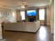 Spacious living room features a large sectional sofa, fireplace, and bright windows for a comfortable and inviting atmosphere at 160 Elysian Dr, Fayetteville, GA 30214