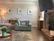 Comfortable living room featuring stylish decor, a stone fireplace, and ample seating for relaxation and entertainment at 160 Elysian Dr, Fayetteville, GA 30214