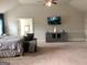 Spacious main bedroom with large bed, TV, console, seating, and decor at 160 Elysian Dr, Fayetteville, GA 30214