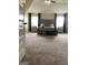 Bright main bedroom with a large bed, side tables, decor, and bench in the center at 160 Elysian Dr, Fayetteville, GA 30214